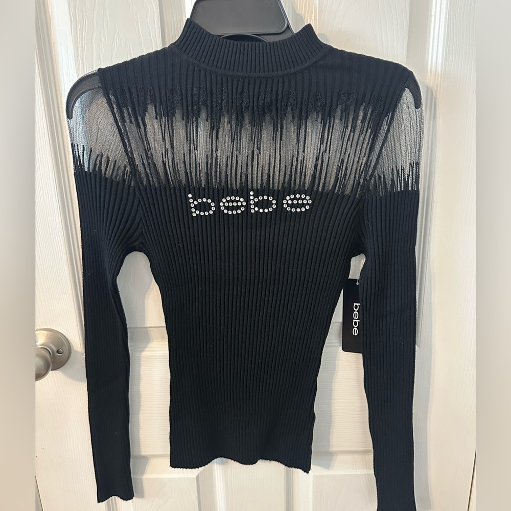 Bebe Black Ribbed sweater with mesh and with Logo Detail. NWT. Stunning!